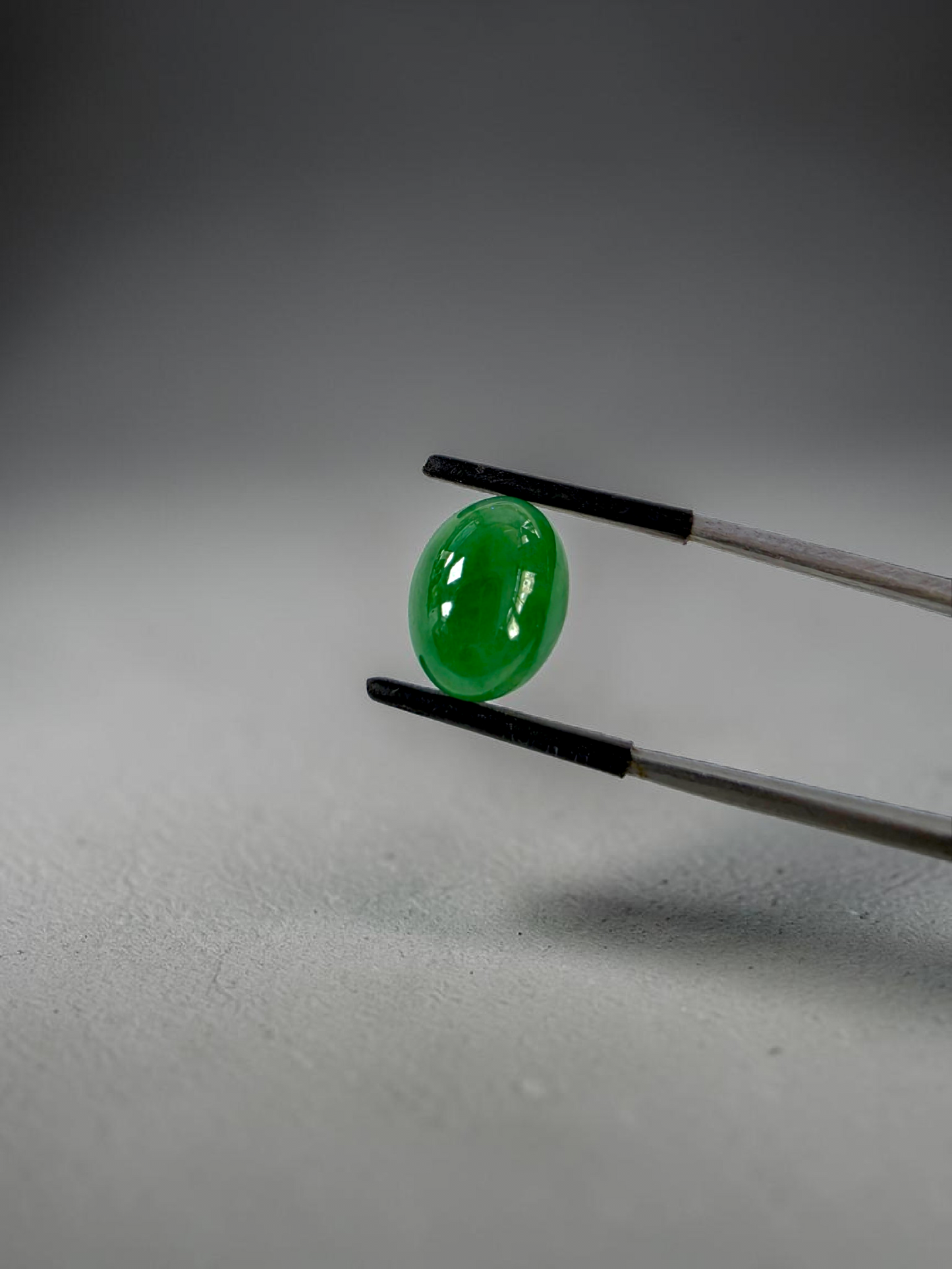 Certified MADE IN JAPAN 9.05 cts. Bright Apple Green Burmese A-Jadeite Oval Cabochon Loose Stone LS63